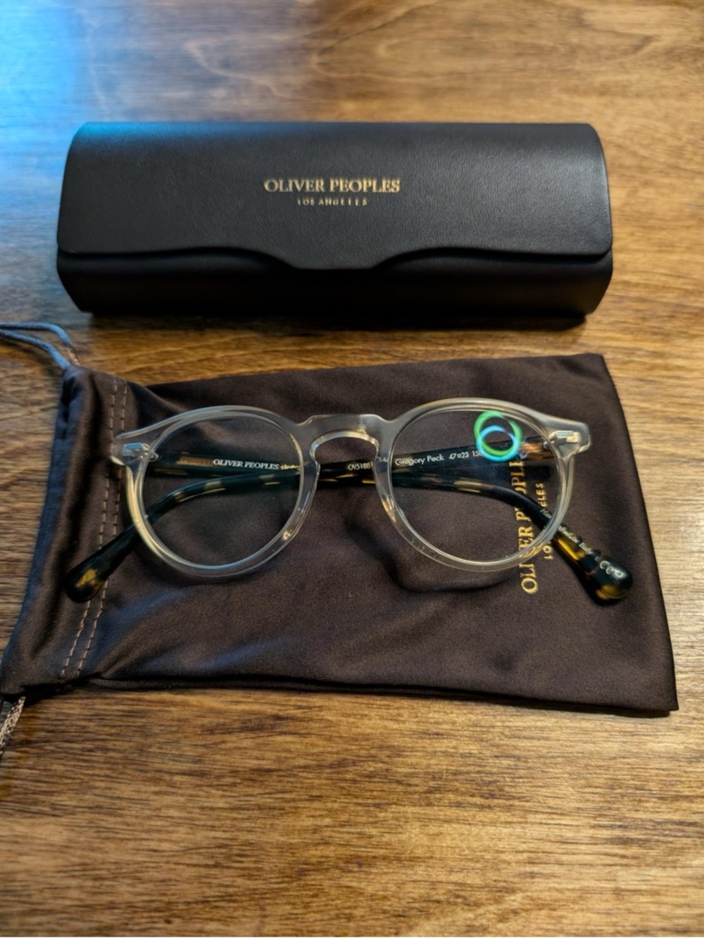 Oliver Peoples Clear Round Frame Glasses with Tortoiseshell Temples
